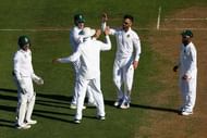 WELLINGTON, NEW ZEALAND - MARCH 16:  JP Duminy of South Africa celebrates with teammates Faf du Plessis and Hashim Amla after taking the wicket of BJ Watling of New Zealand during day one of the Test match between New Zealand and South Africa at Basin Reserve on March 16, 2017 in Wellington, New Zealand.  (Photo by Hagen Hopkins/Getty Images)